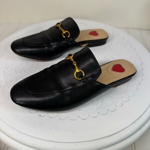 ARQA black leather almond toe mules